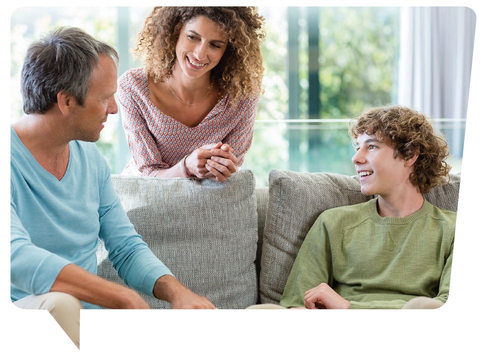 Woman, man and teenager talking at home on couch